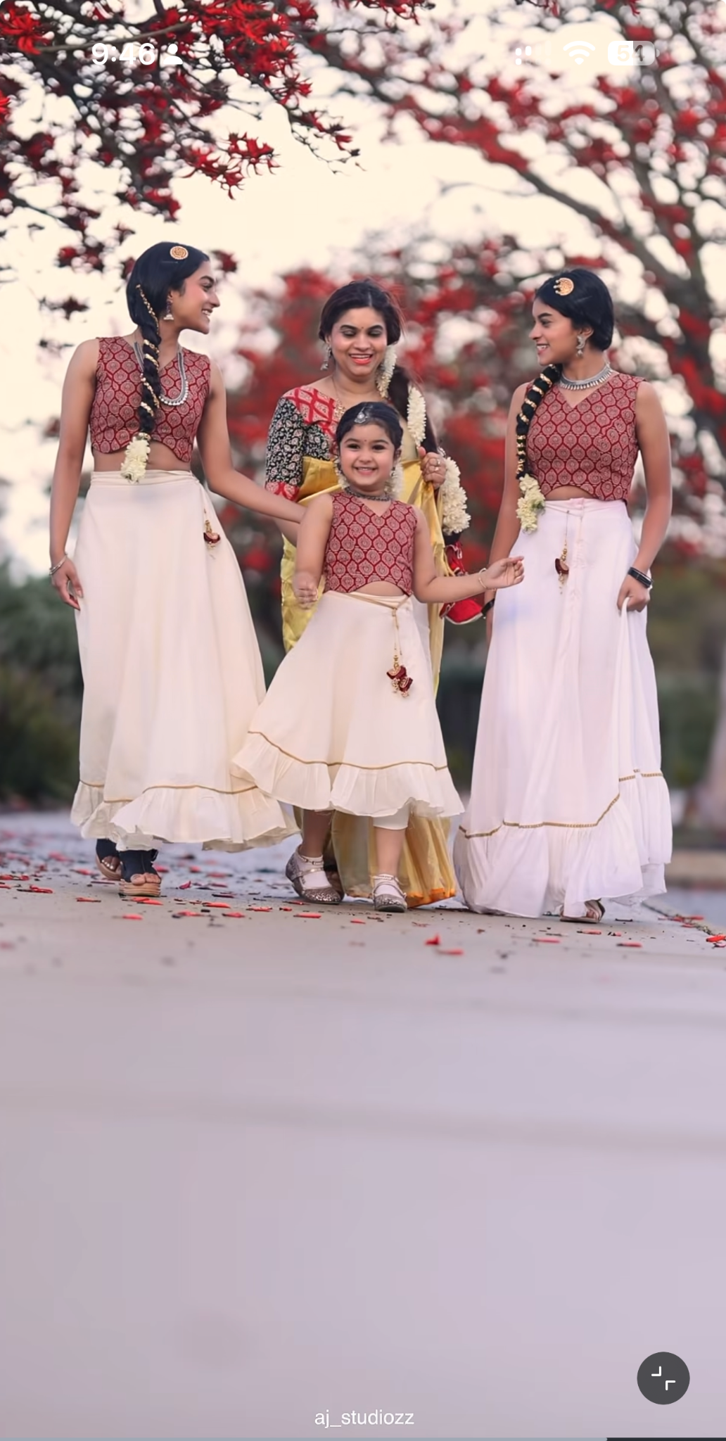 Family walking together in traditional Kerala attire during an Onam shoot