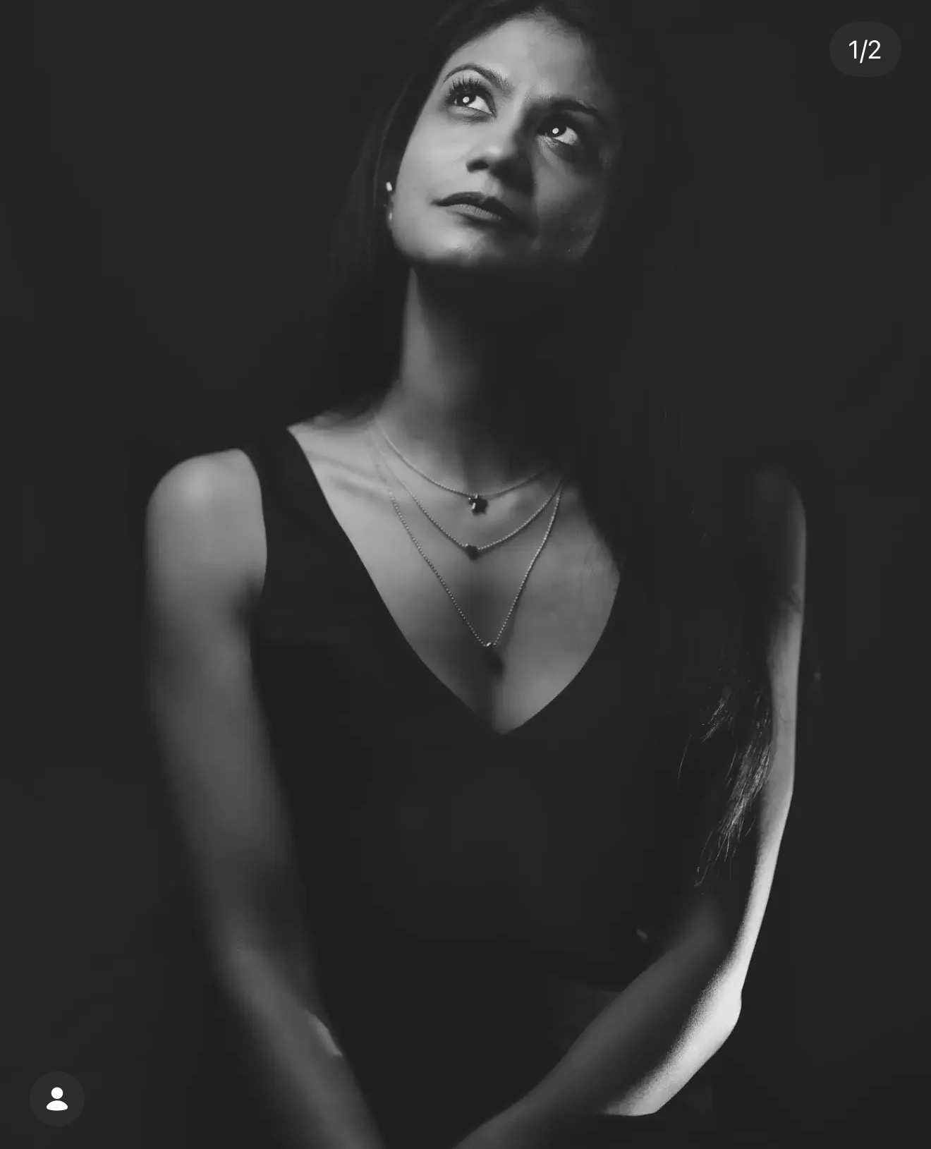Thoughtful monochrome portrait of Renu representing the creative process at AJ Studiozz
